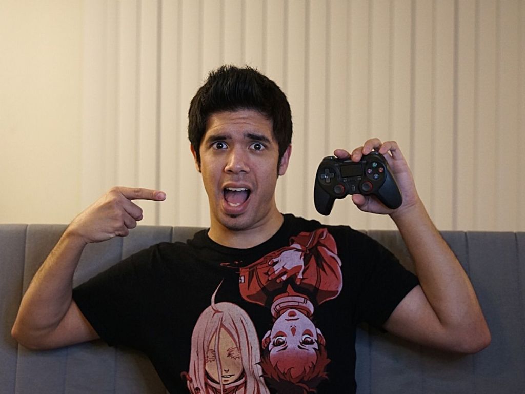 man holding up Terios Wireless Pro Controller