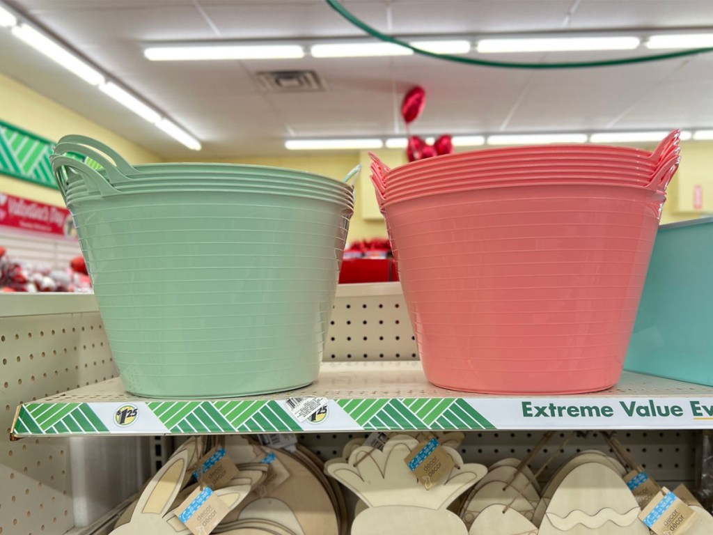 one green and one pink bucket on shelf at dollar tree