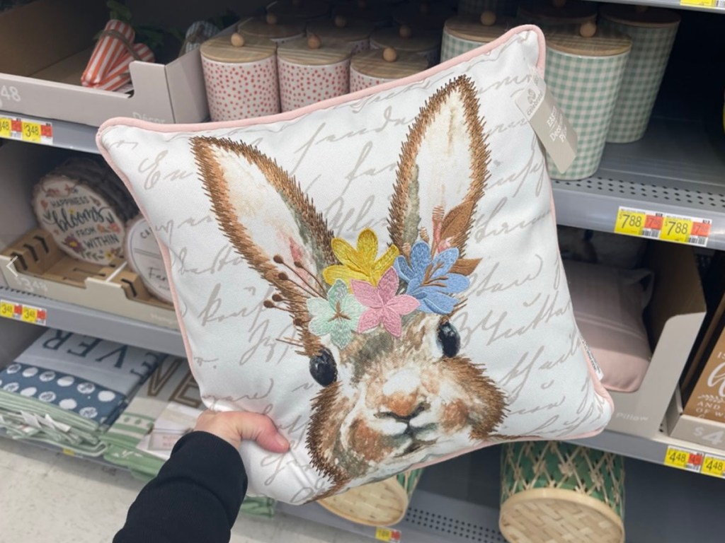 hand holding easter bunny square pillow