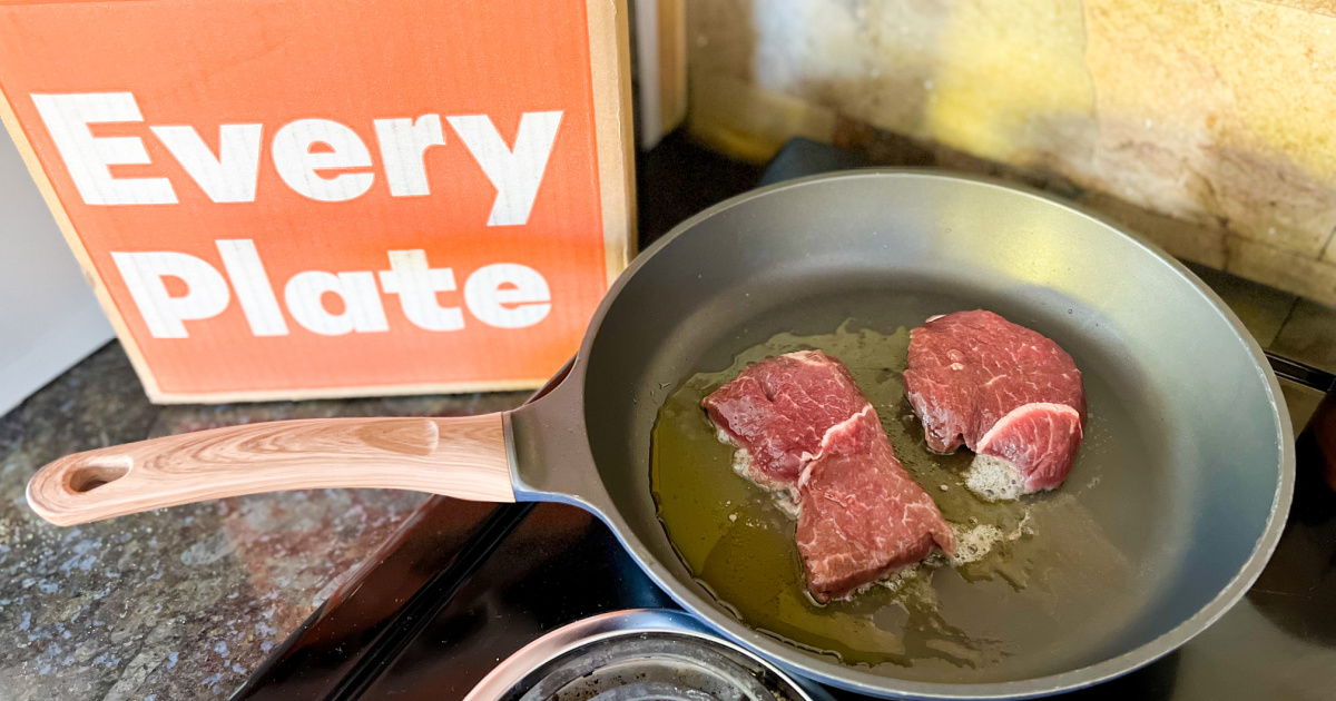 steaks on frying pan