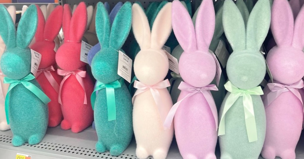 a row of multi-colored focked bunnies on shelf