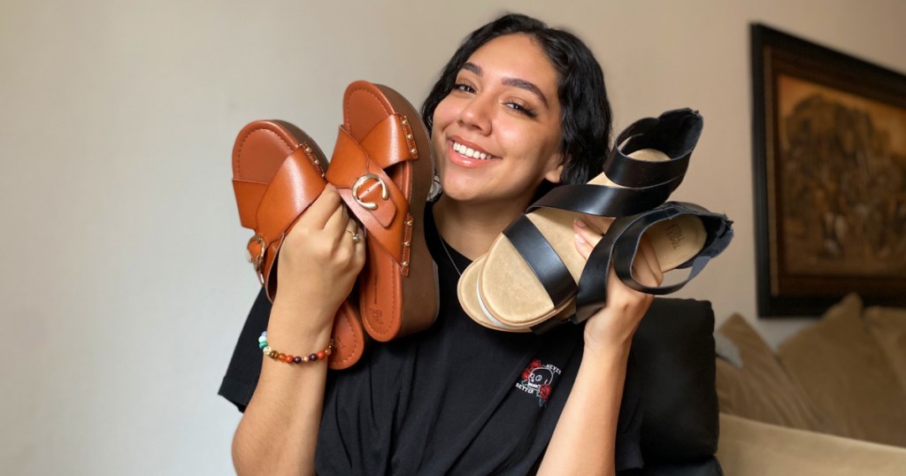 woman holding time and tru sandals