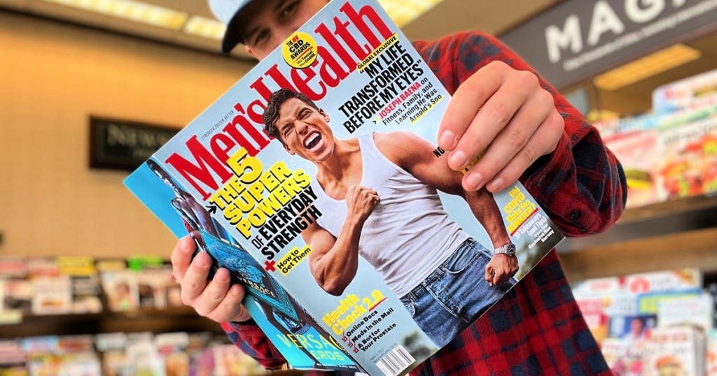 man holding men's health magazine