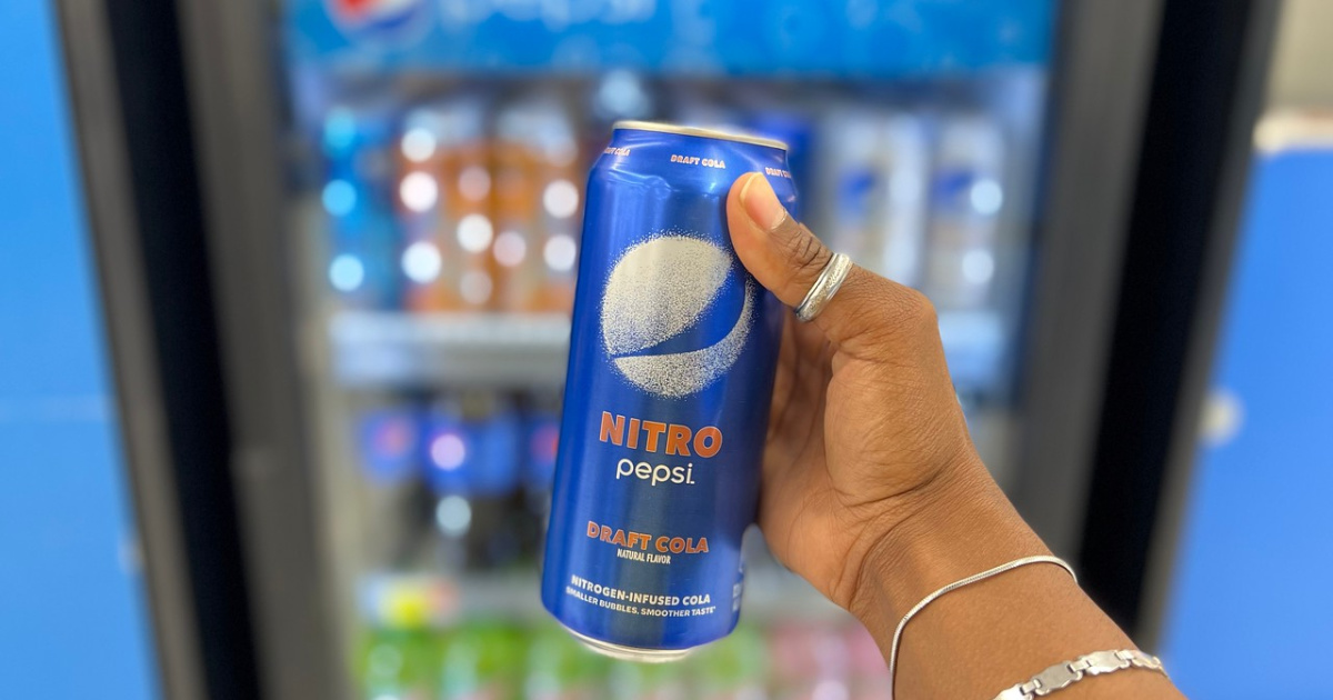 woman holding pepsi nitro can