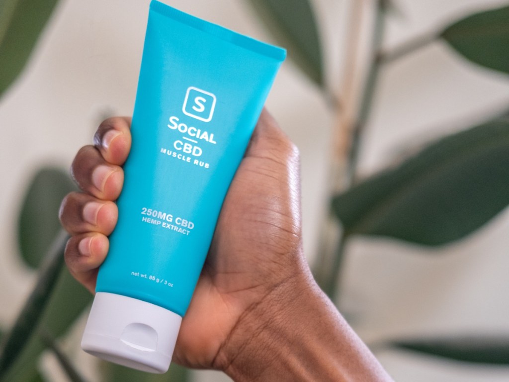 hand holding CBD muscle rub
