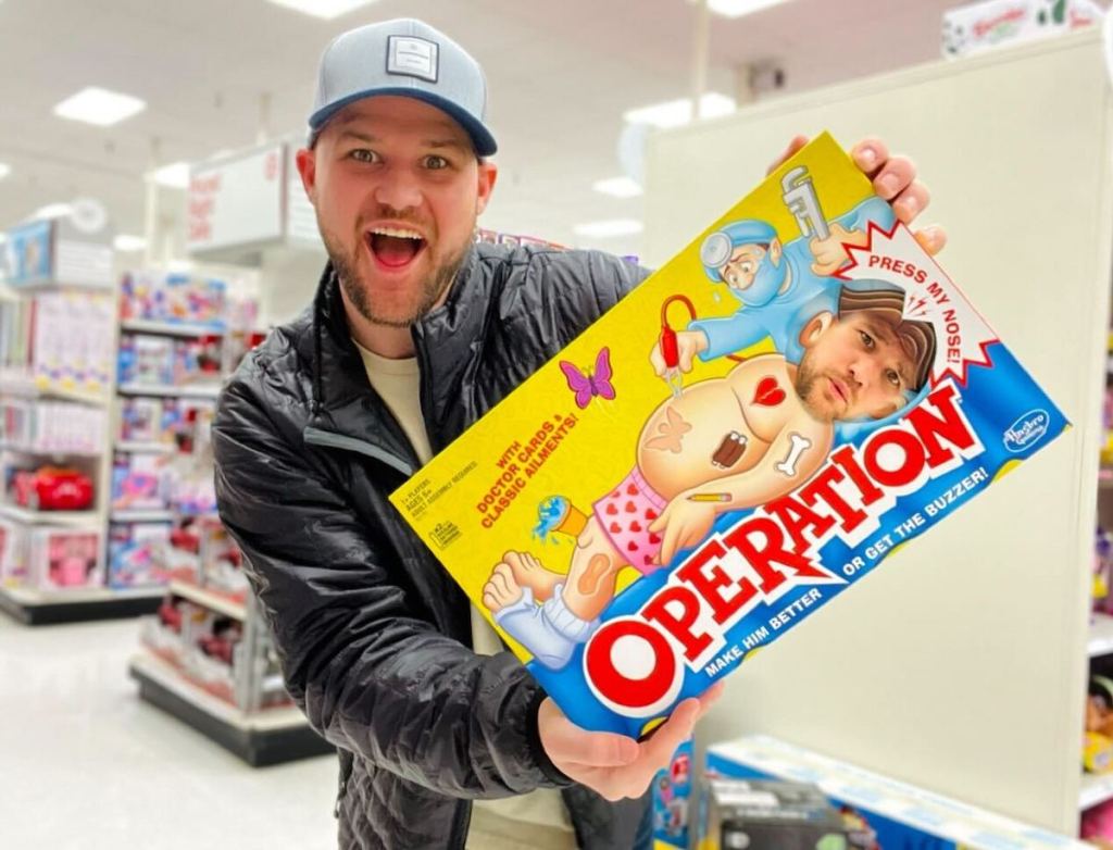 man holding a photoshopped operation board game in store