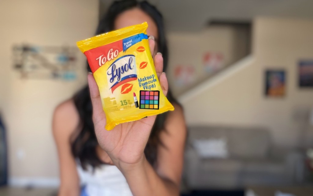 woman holding lysol makeup wipes