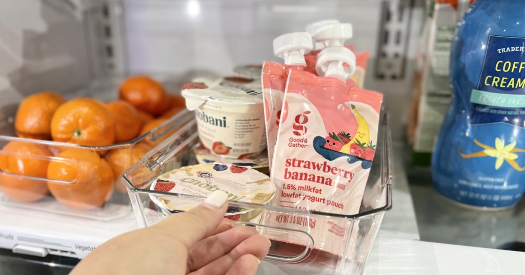 yogurts and fruits placed front and center of the fridge for easy snacking is one of our best fridge organization ideas