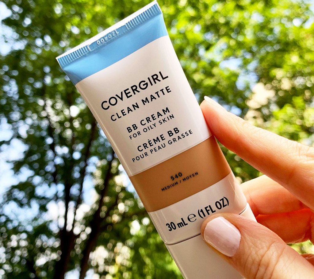 hand holding tube of CoverGirl Clean Matte BB Cream