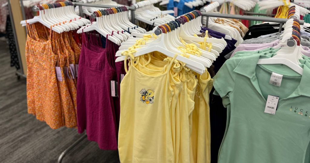 yellow, orange, red and green dresses on racks 