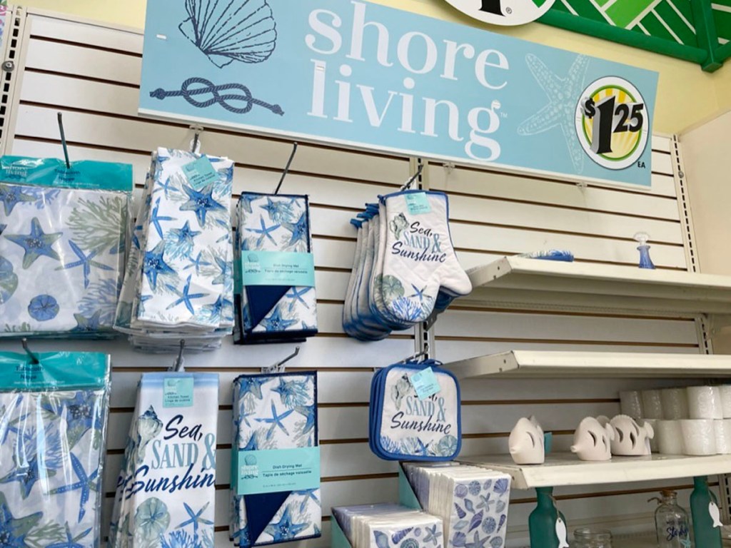 beach themed kitchen dish towels, pot holders and more hanging in dollar tree