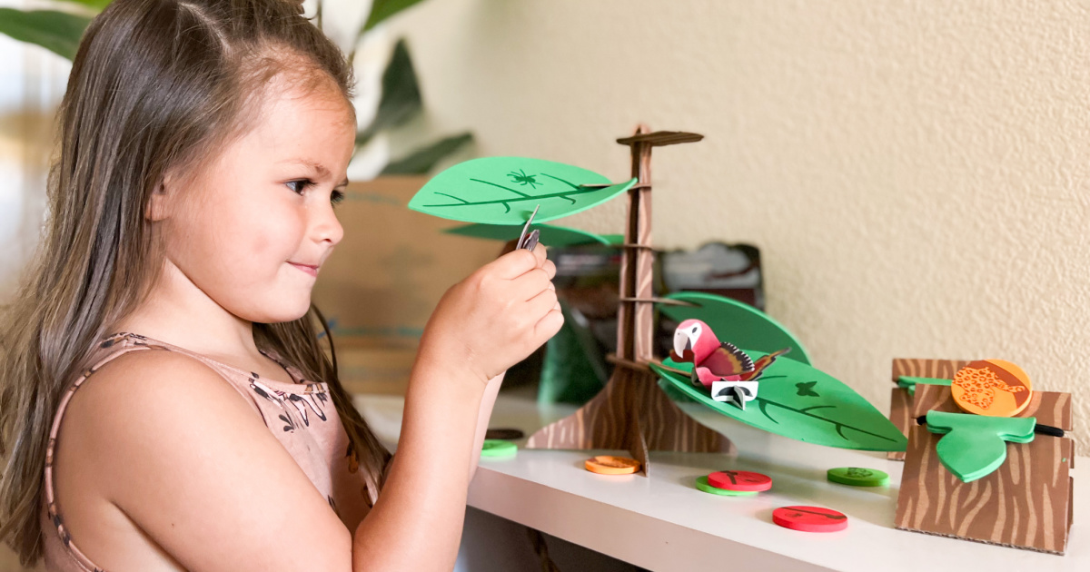 little girl playing with little pasports