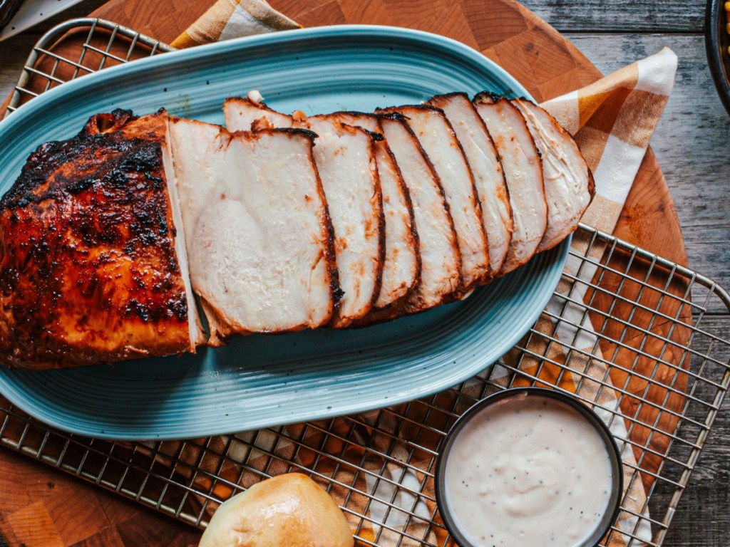 sliced turkey breast on blue platter