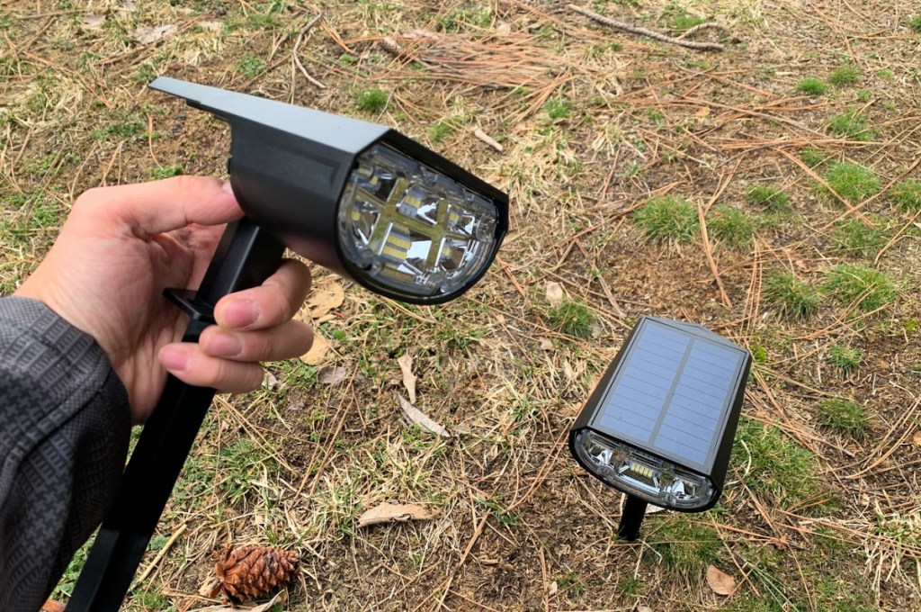 man holding a Solar Outdoor Spot Light