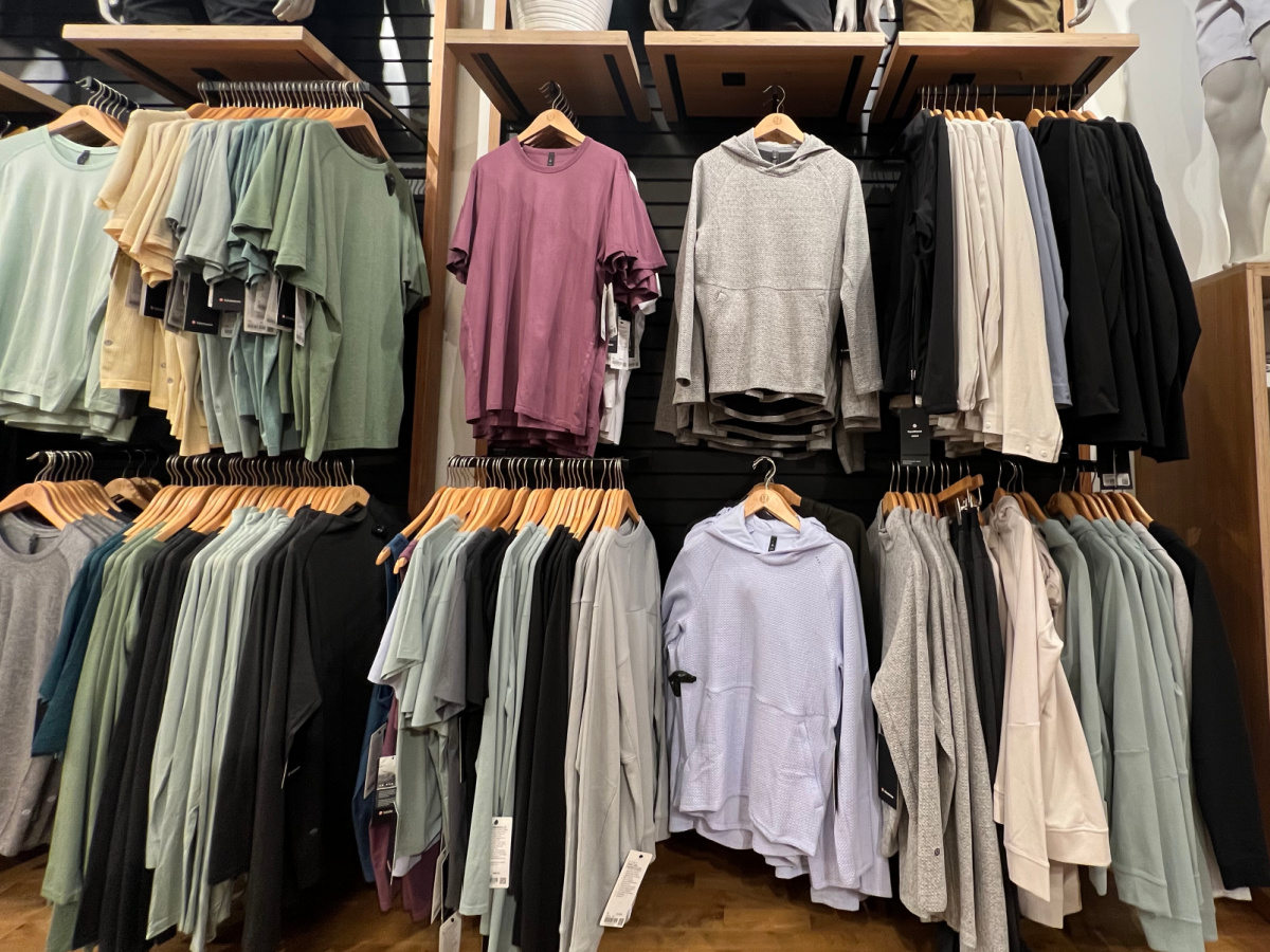 mens clothes hanging in store for display