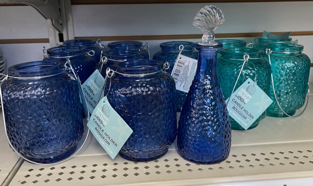 blue and teal nautical themed candle holders on shelf