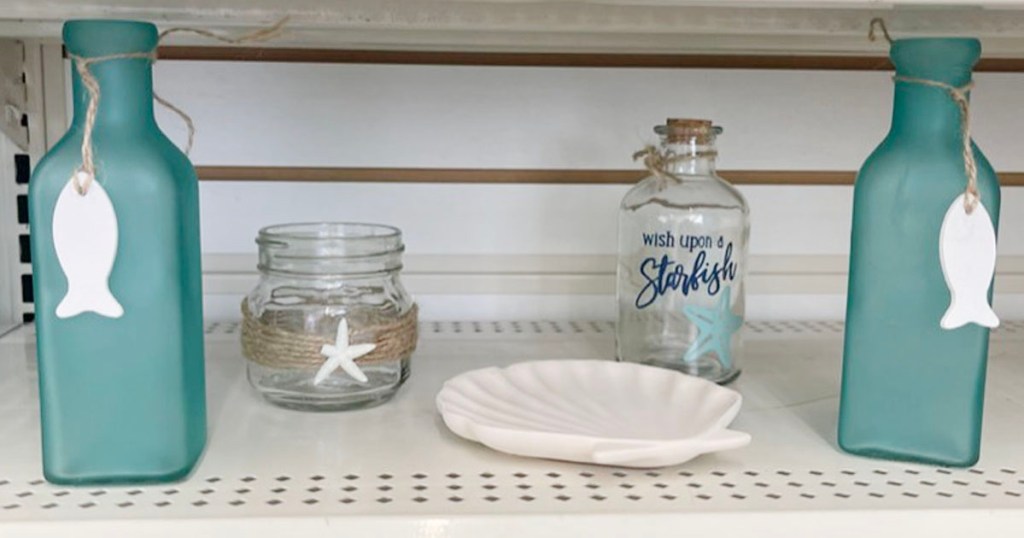 glass nautical decor on shelf 