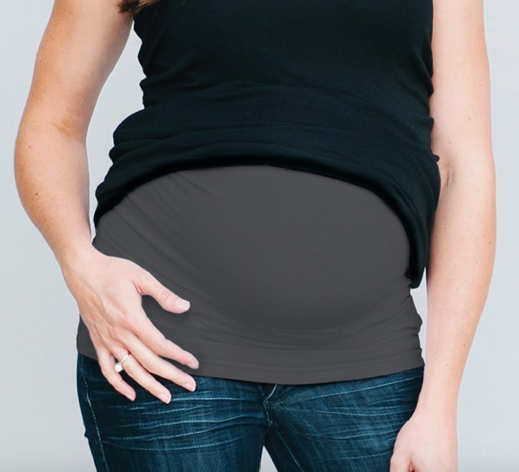 close up of pregnant belly with gray band and black shirt