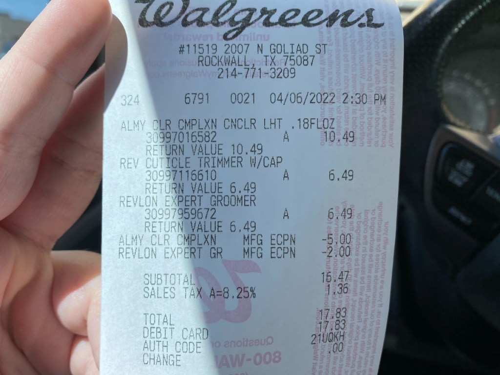 holding a Walgreens receipt