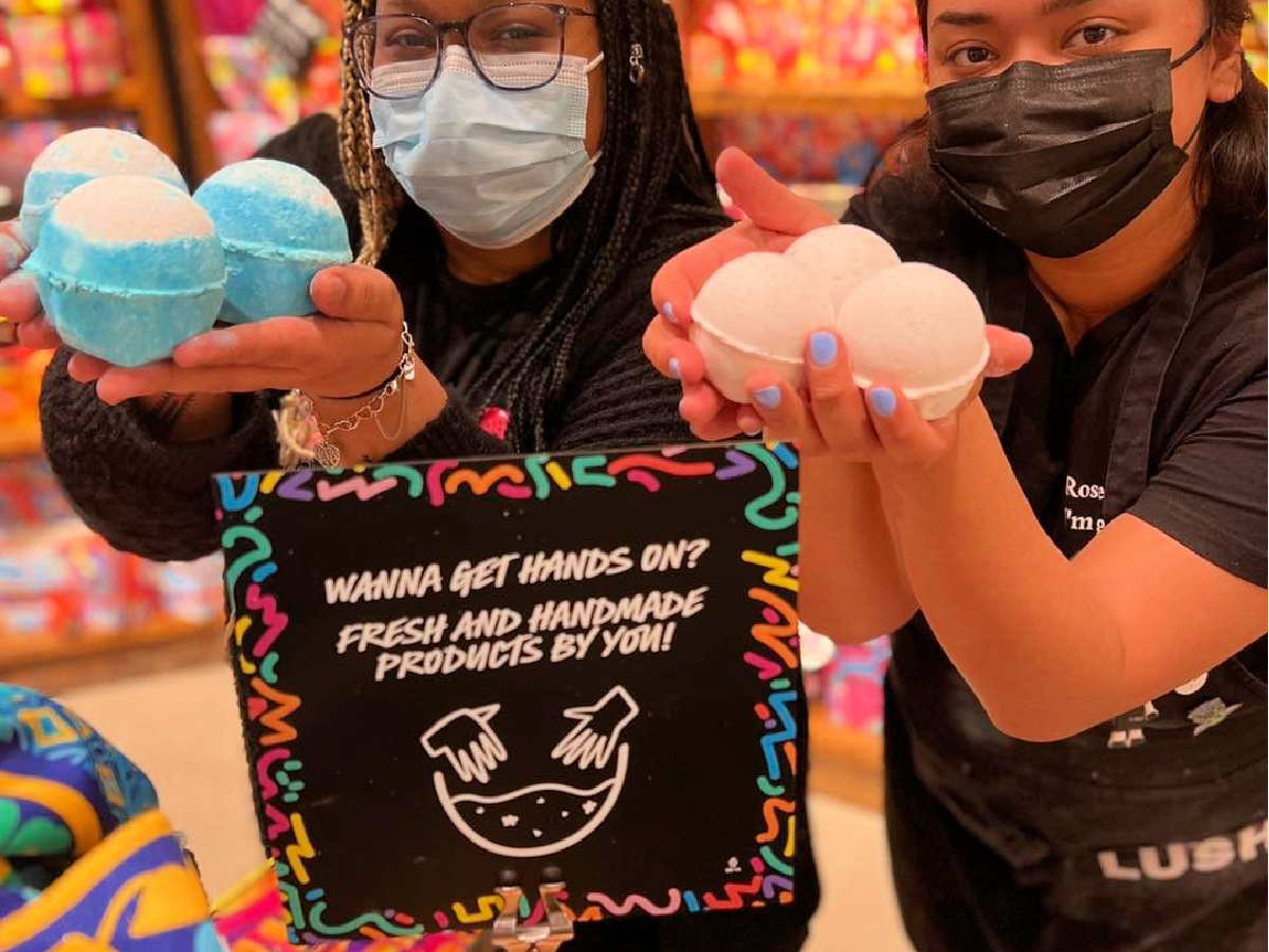 women holding lush bath bombs