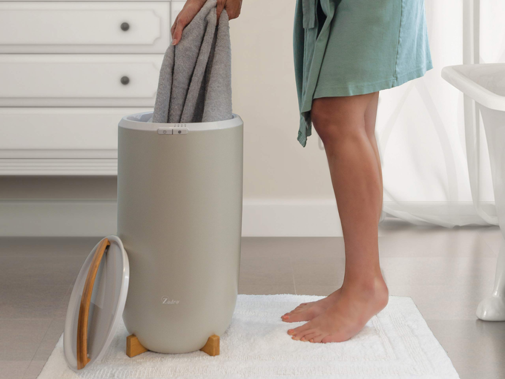 pulling a towel from a towel warmer