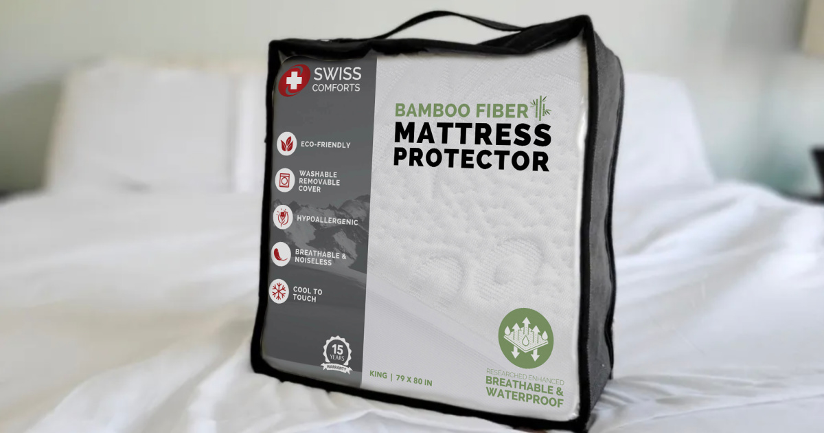 mattress protector in packaging sitting on a bed