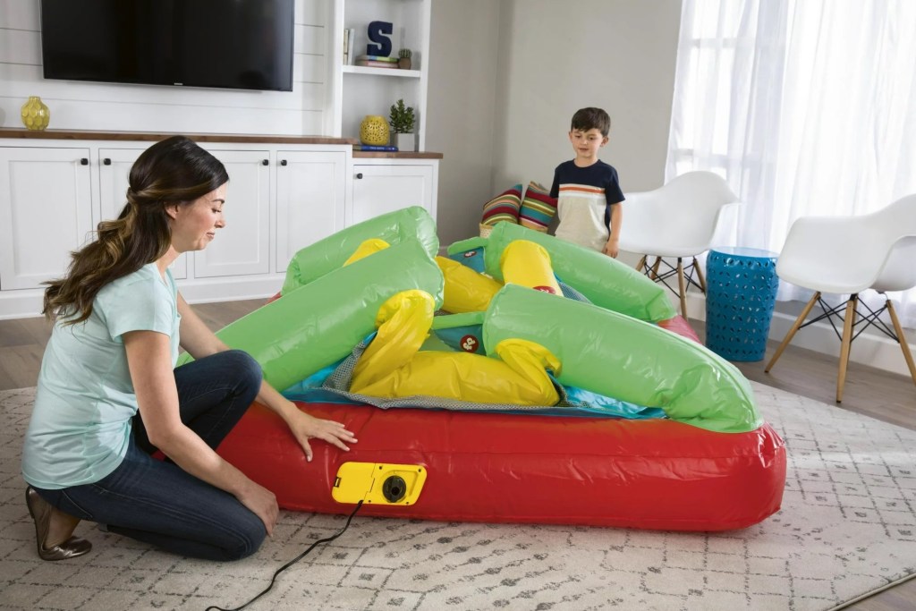 mom deflating Fisher Price Bouncetastic