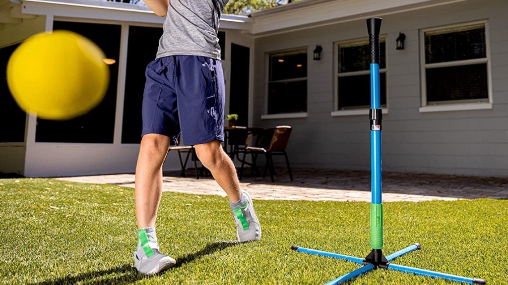 Kid hitting a foam ball off a tee