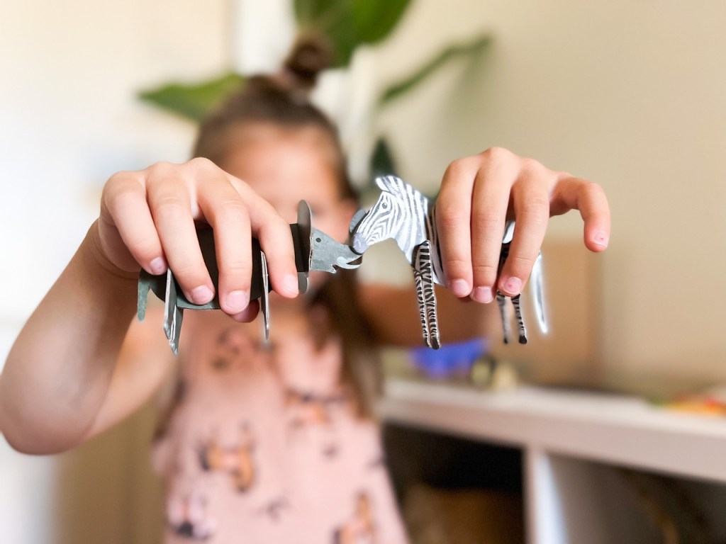 Girl Playing with Little Passports