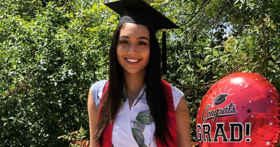 Graduate with balloon who received student loan grants 