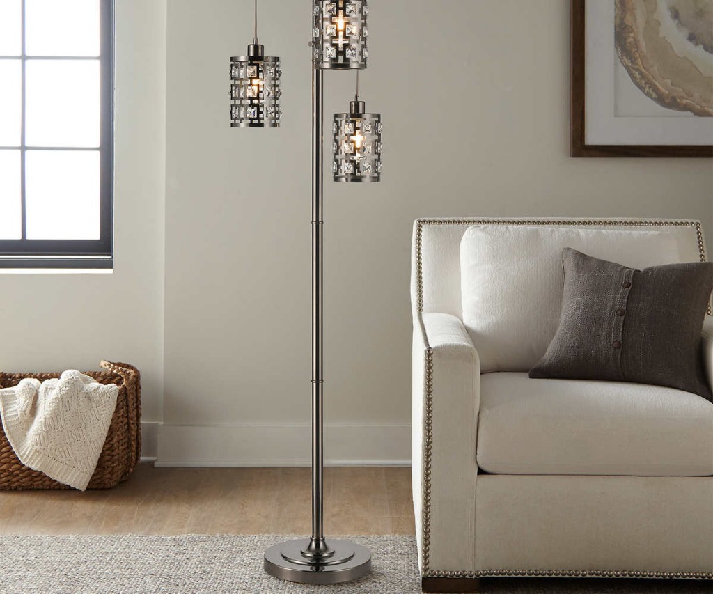 dark gray three-light floor lamp in home