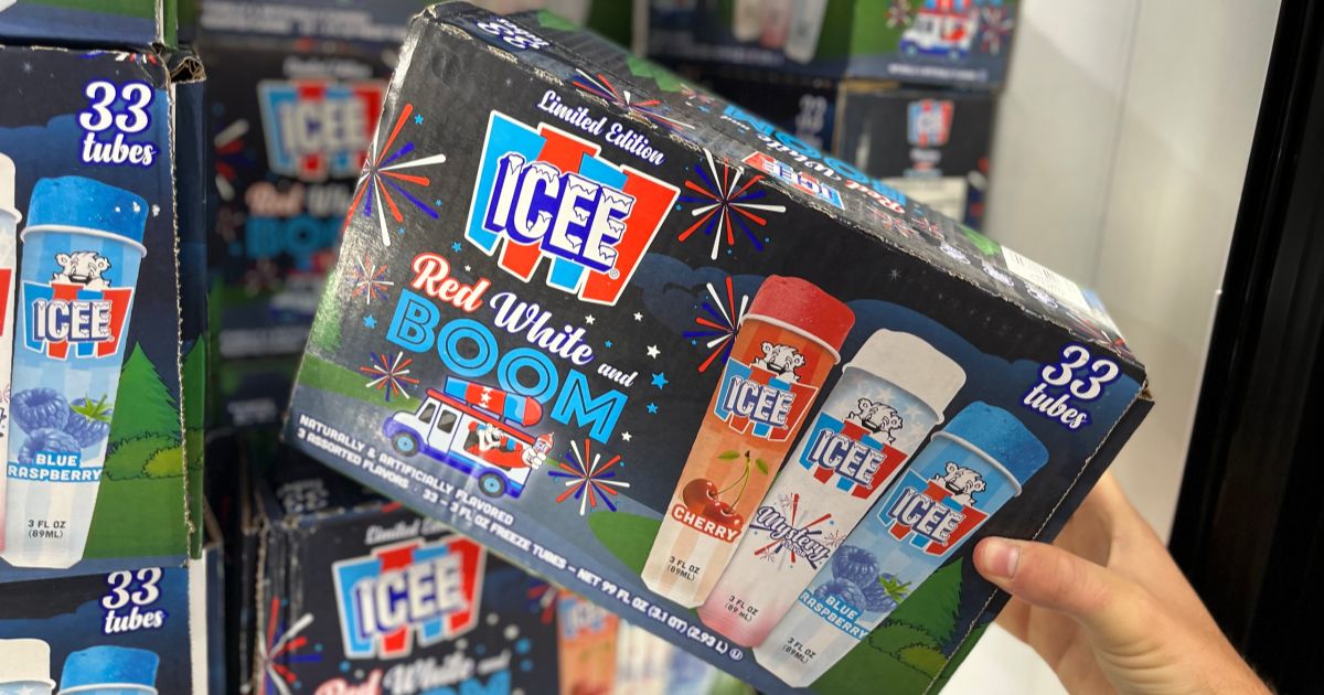 a mans hand holding a box of Icee boom pops