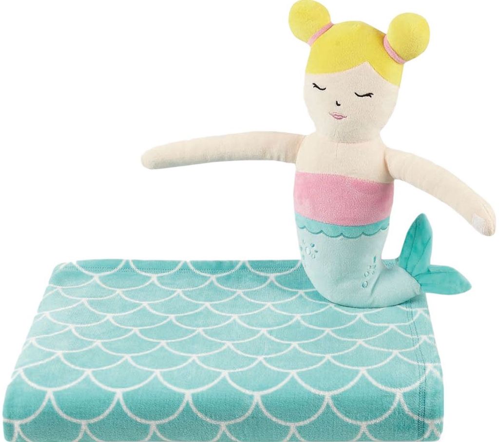 Mermaid plush sitting on a blue blanket