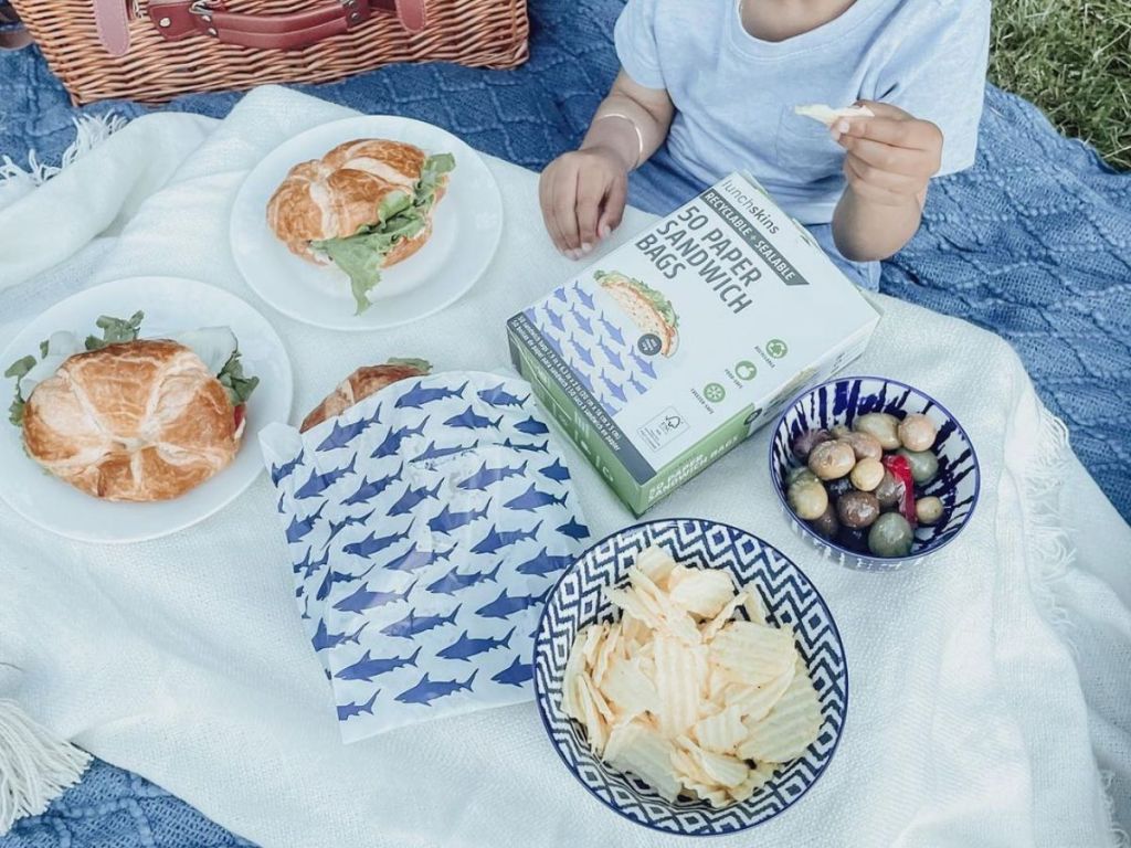 Lunchskins shark bags with kid eating snacks