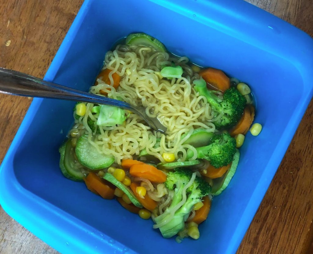 ramen inside a blue rapid mac cooker