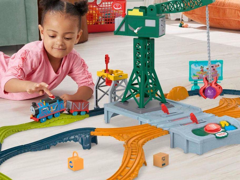 A child playing with a train set