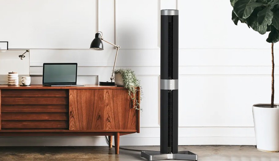 tower fan near console table and plant