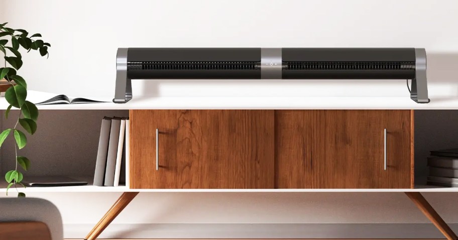 black tower fan horizontal on top of console table