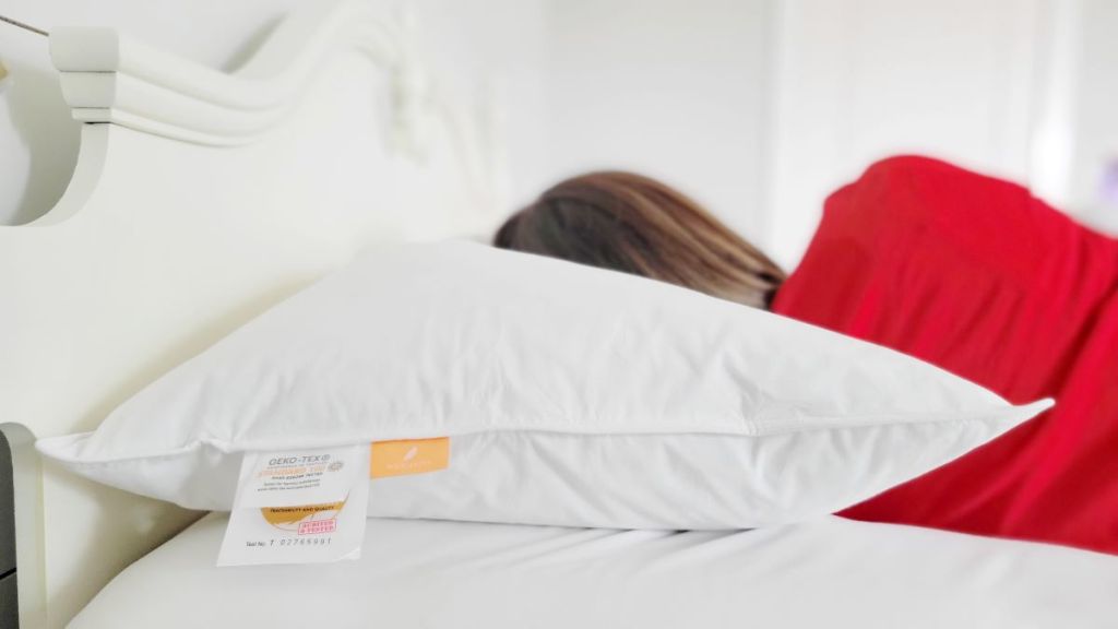 woman laying on a pillow