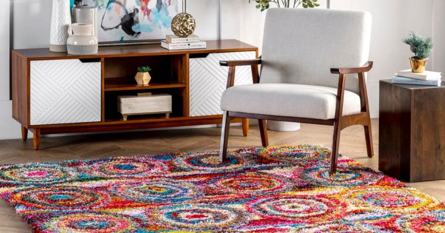 living room with a chair on a rug