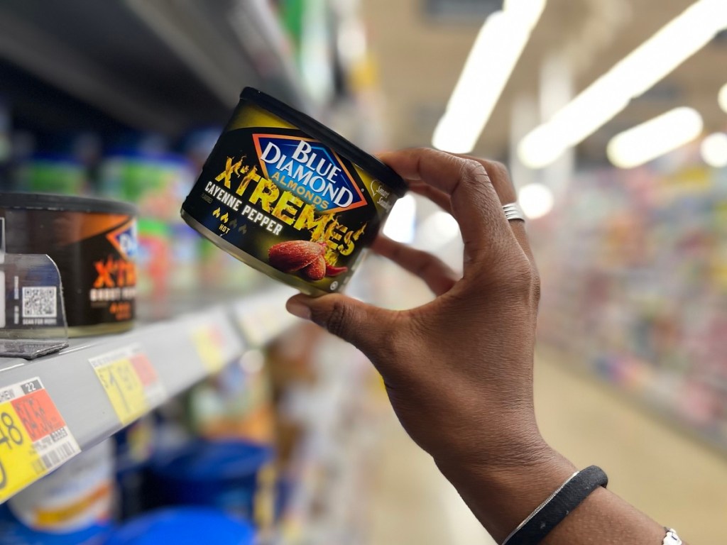 removing a can of Blue Diamond Xtremes from a Walmart shelf