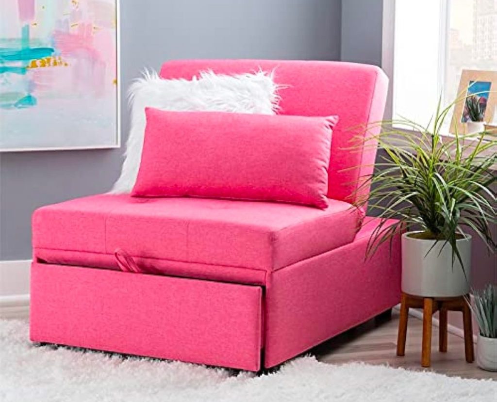 a hot pink convertible flip chair in corner of a room.