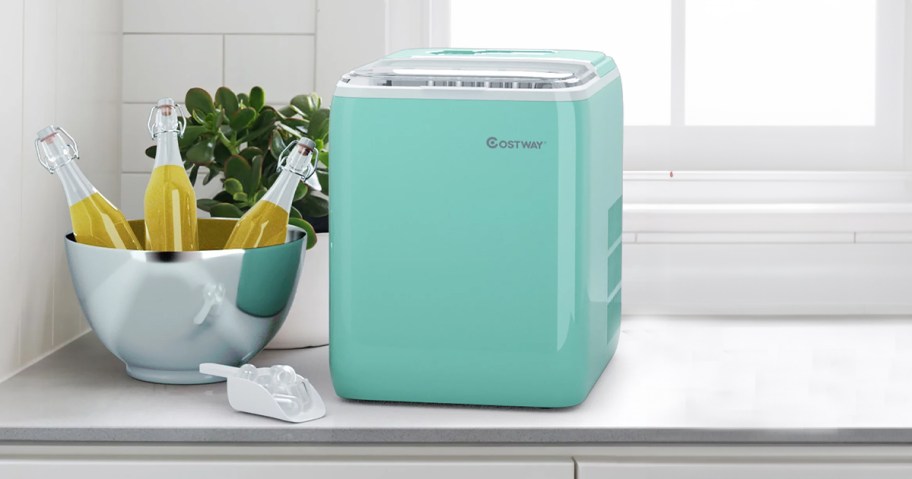 teal countertop ice maker on table