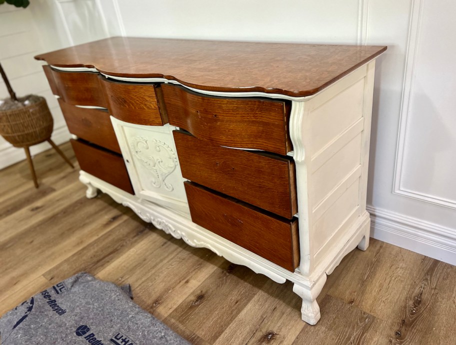 wood dresser against wall