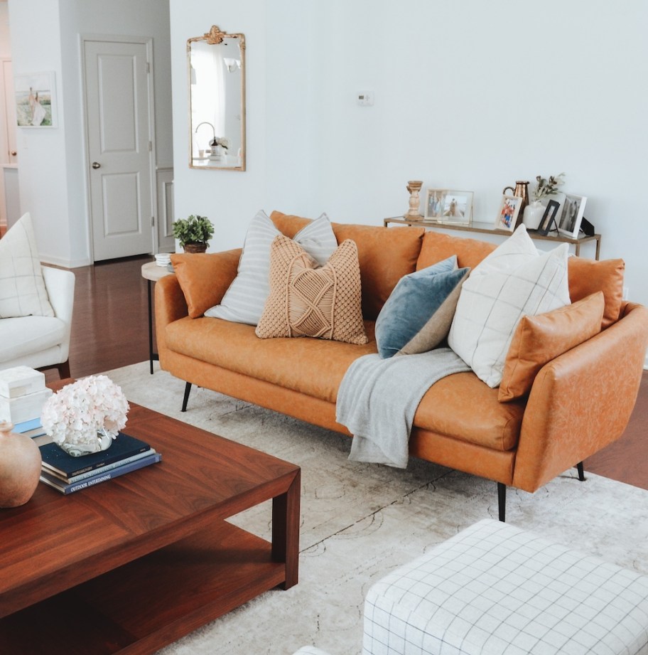 Albany Park faux leather sofa with pillows 