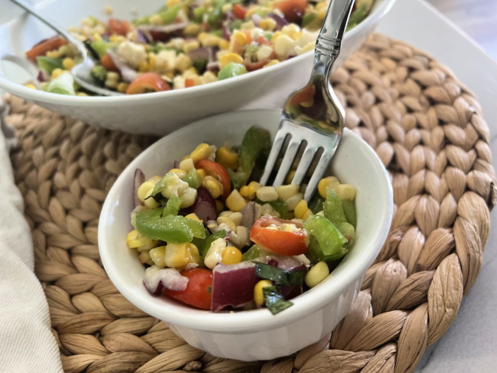 fork scooping some summer corn salad