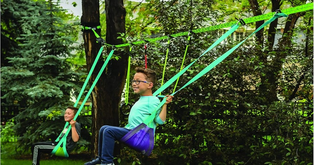 kids swinging on a slackline swingset