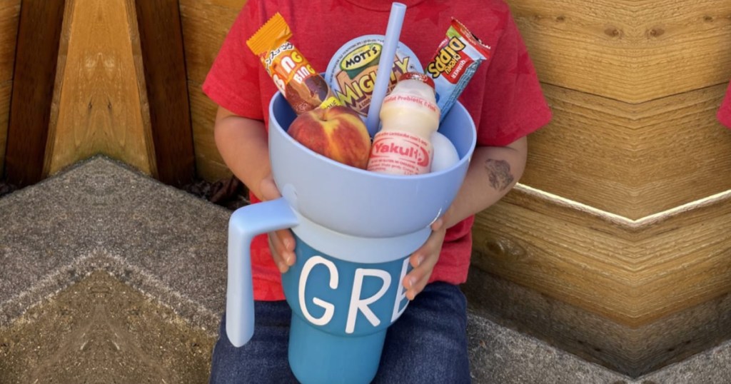 boy holding snack cup