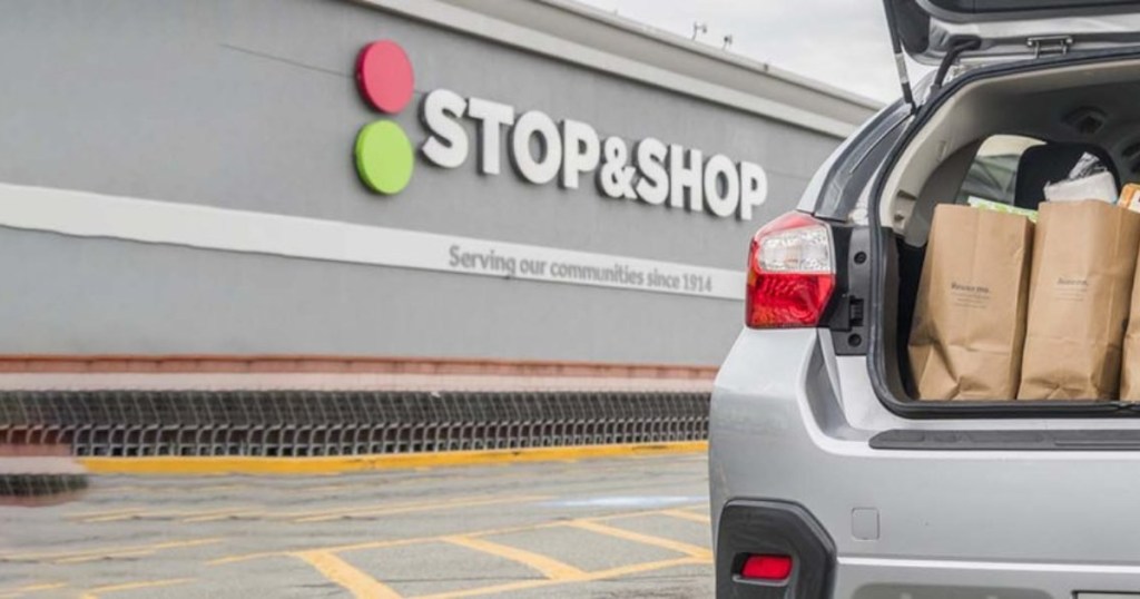 car with grocery bags in trunk outside Stop & Shop