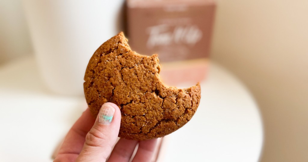 woman holding a tone it up cookie